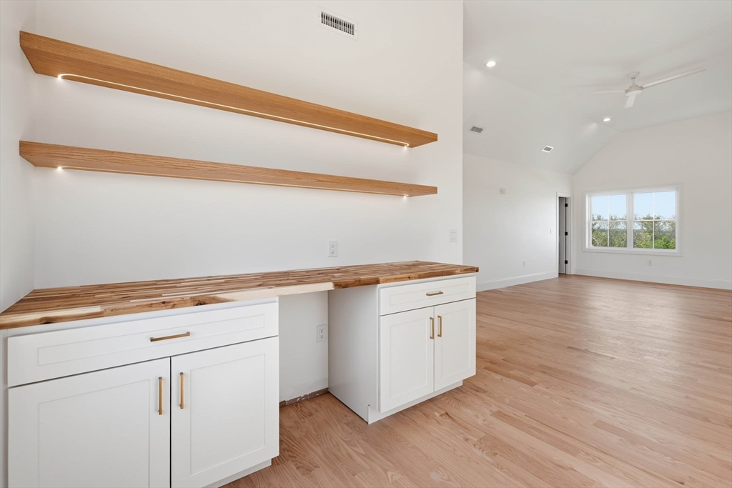 16 Couture Way Middleton, MA 01949 - Photo 22 of 36 a view of cabinets with wooden floor