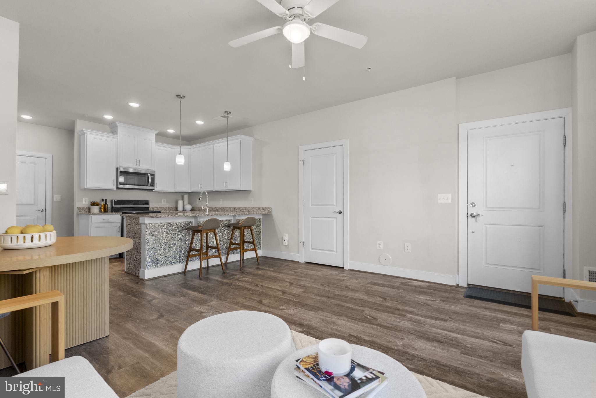 9610 Fields Road, Unit 9610 Gaithersburg, MD 20878 - Photo 7 of 29 Living Room open to Kitchen