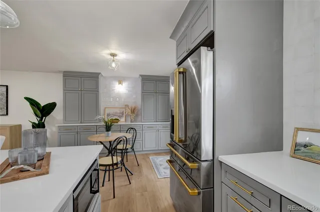 a kitchen with a table and chairs