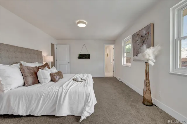 a bedroom with bed and window