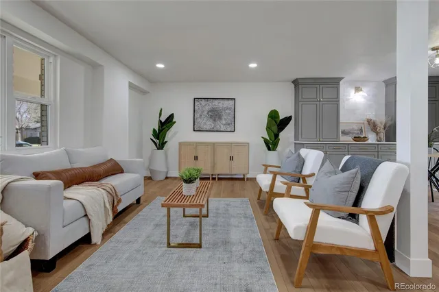 a living room with furniture and a rug