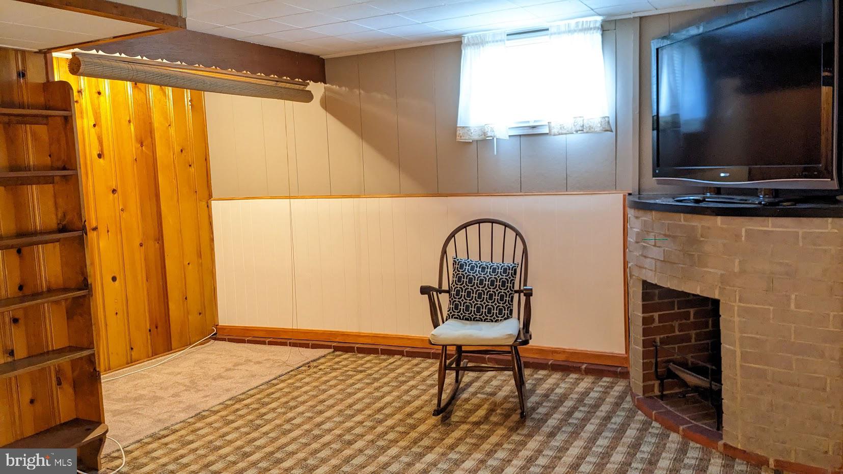 2903 Church Road Parkville, MD 21234 - Photo 25 of 37 a living room with chair and a flat screen tv