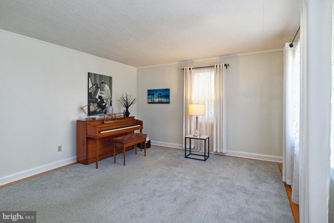 2903 Church Road Parkville, MD 21234 - Photo 4 of 37 a room with a baby crib and a dresser