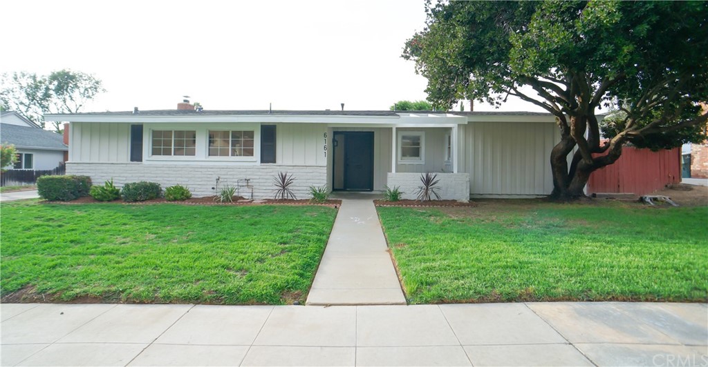 6161 Duquesne Street Riverside, CA 92506 - Photo 1 of 1 a front view of a house with a yard and potted plants