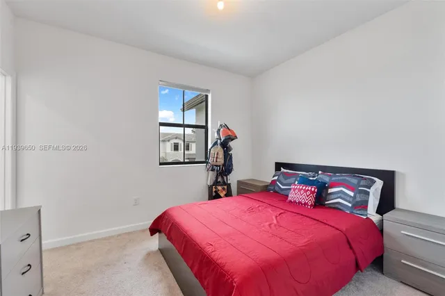 a bedroom with a bed and a closet