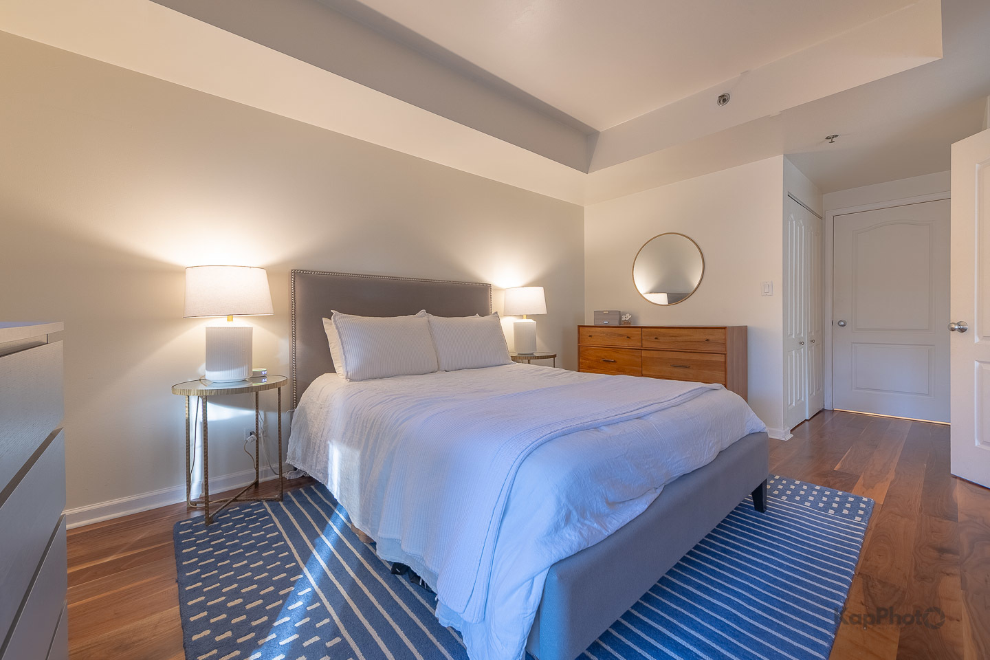 1212 North Wells Street, Unit 303 Chicago, IL 60610 - Photo 11 of 22 a bedroom with a bed and wooden floor