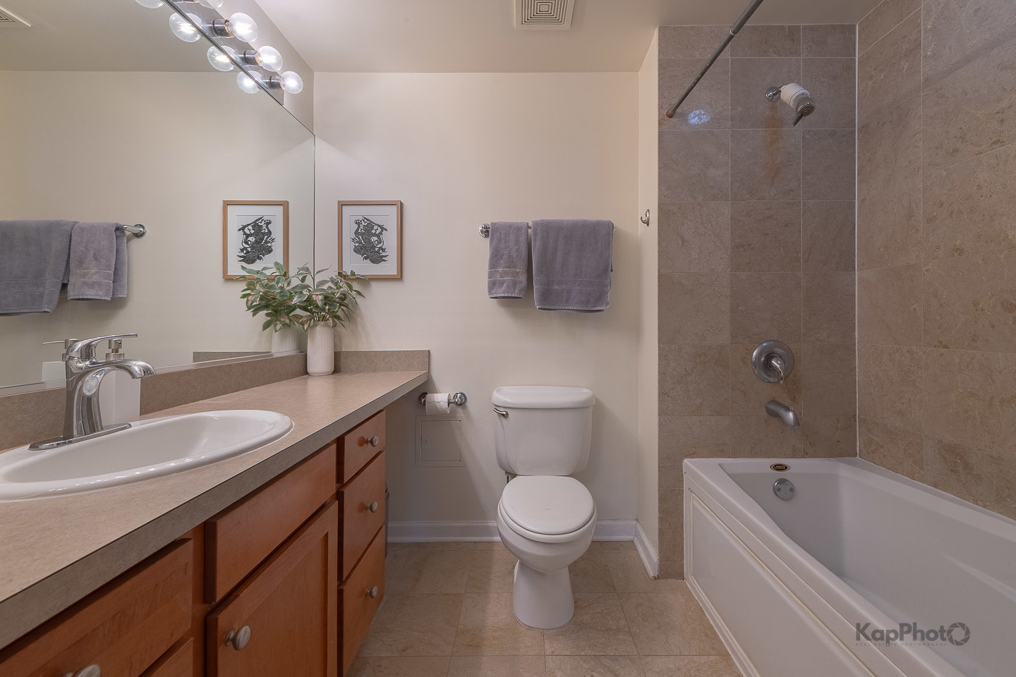 1212 North Wells Street, Unit 303 Chicago, IL 60610 - Photo 14 of 22 a bathroom with a granite countertop sink a toilet and bathtub