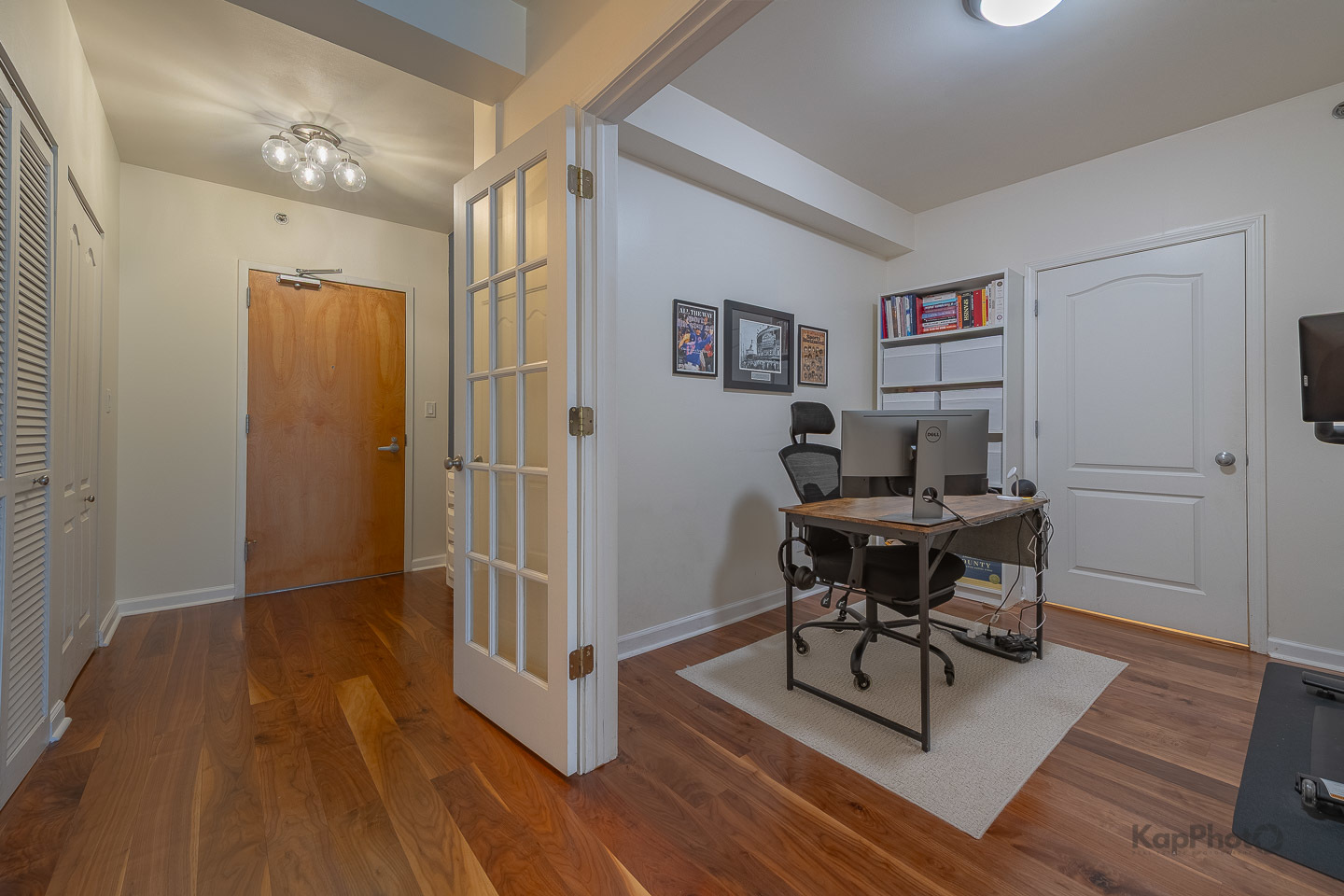 1212 North Wells Street, Unit 303 Chicago, IL 60610 - Photo 17 of 22 a view of a workspace with furniture and wooden floor