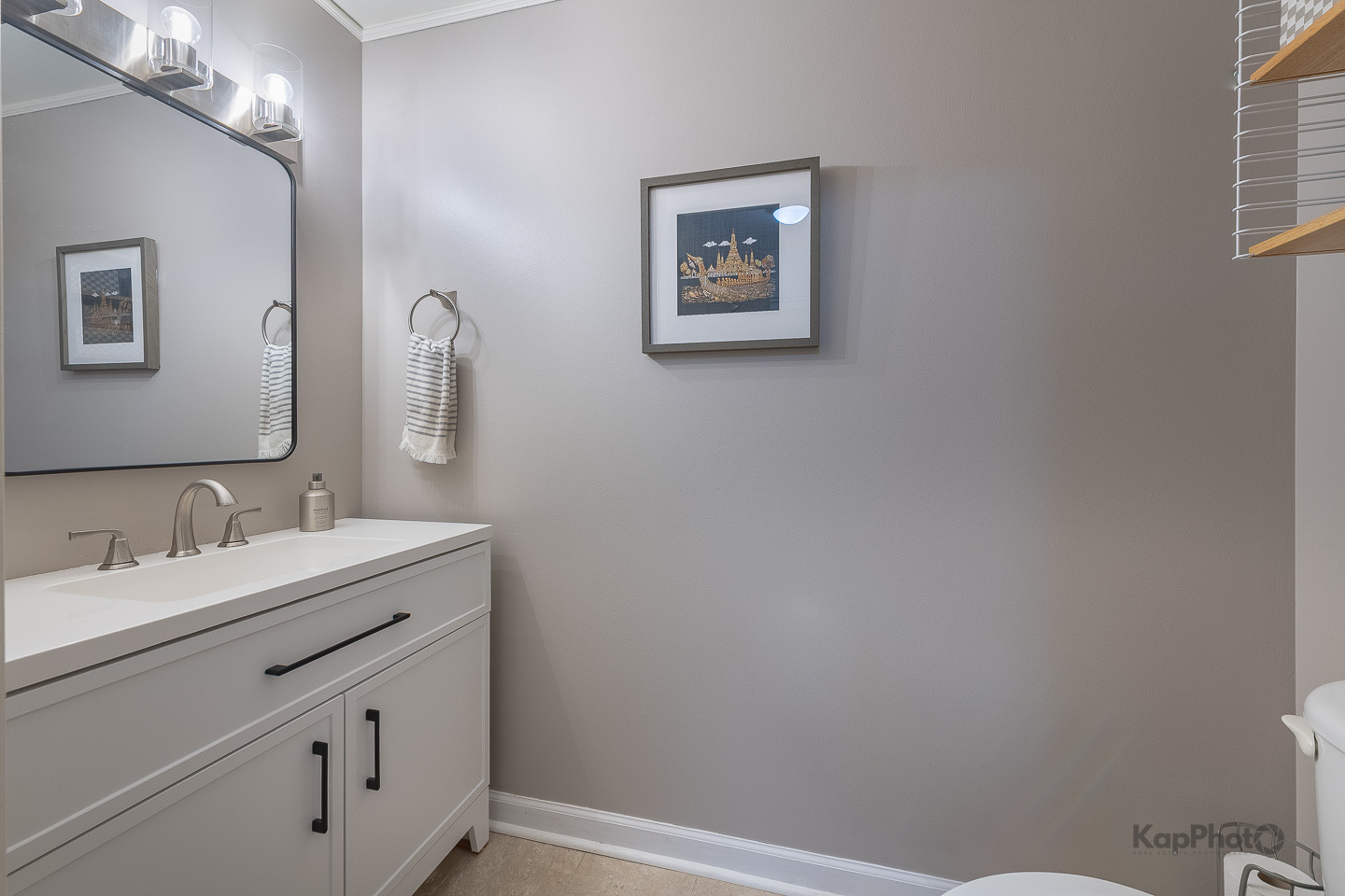 1212 North Wells Street, Unit 303 Chicago, IL 60610 - Photo 18 of 22 a bathroom with a double vanity sink and a mirror