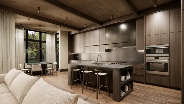 a kitchen with a stove a refrigerator and furniture