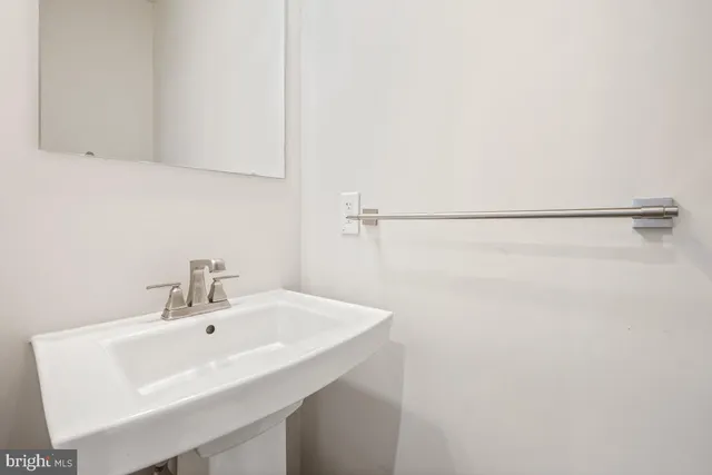 a bathroom with a sink and a shower
