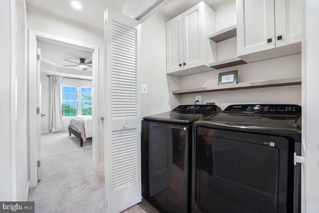 a kitchen with stainless steel appliances and cabinets