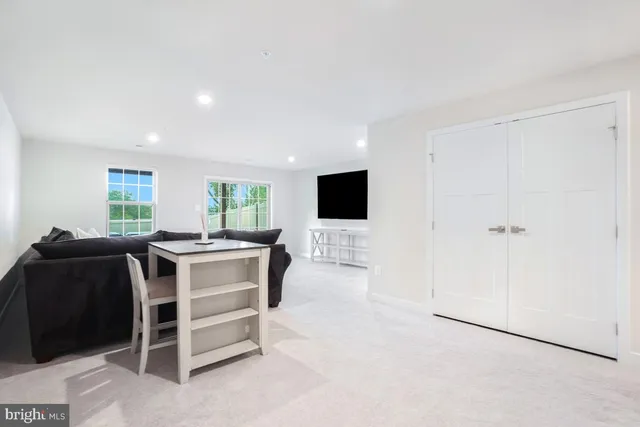 a view of a livingroom with furniture window and a living room