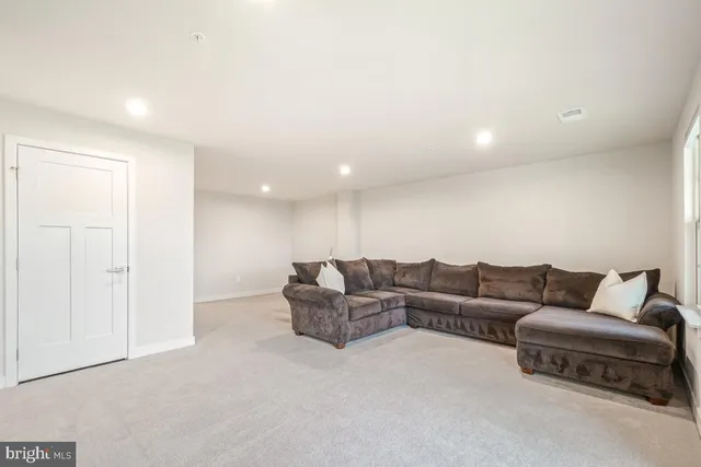 a living room with furniture and a couch