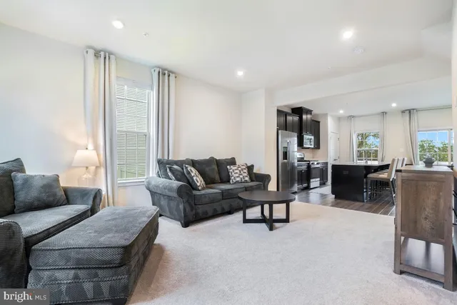 a living room with furniture and a table