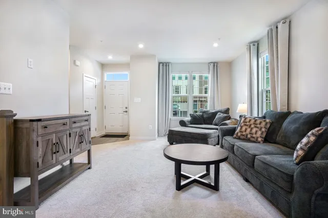 a living room with furniture and a rug