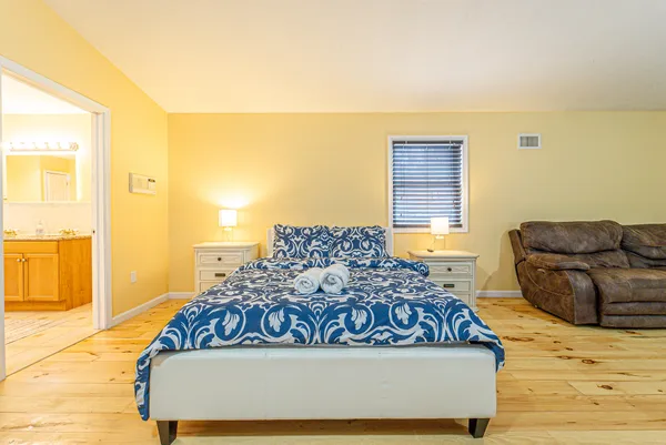 a living room with a couch and dresser