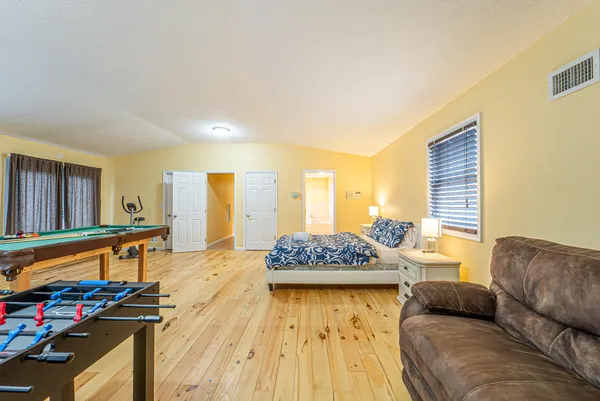 a bedroom with furniture and a window
