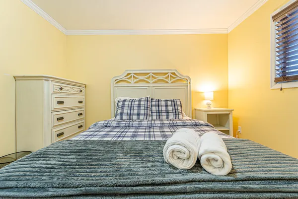 a view of a bedroom with wooden floor
