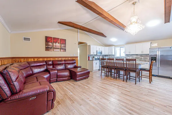 a reading room with furniture and wooden floor