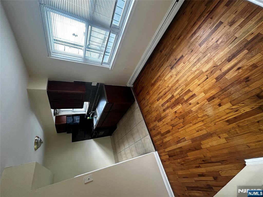 218 Cliff Street, Unit 1 Cliffside Park, NJ 07010 - Photo 3 of 7 a living room with furniture and a flat screen tv