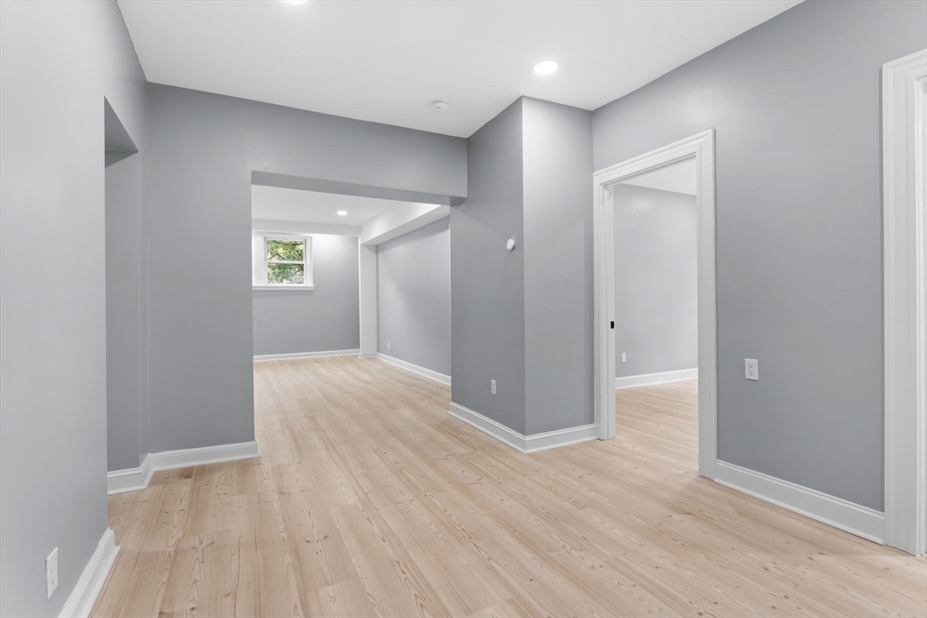 127 Winthrop Road, Unit 12A Brookline, MA 02445 - Photo 5 of 41 wooden floor in an empty room with a window