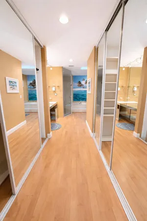 a bathroom with a tub a sink and a mirror