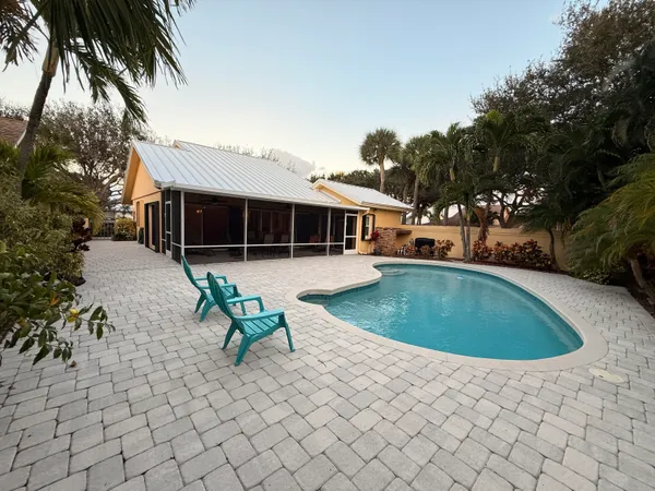 a view of a swimming pool with a lounge chairs