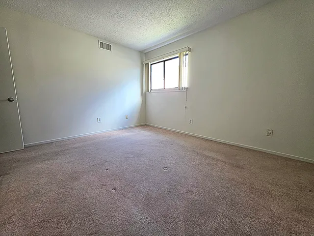 a view of entryway with wooden stairs