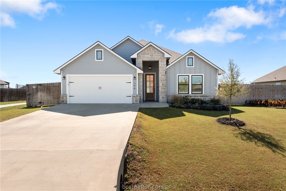 244 Brazos Bend Snook, TX 77879 - Photo 1 of 33 a view of a house with a yard and large tree