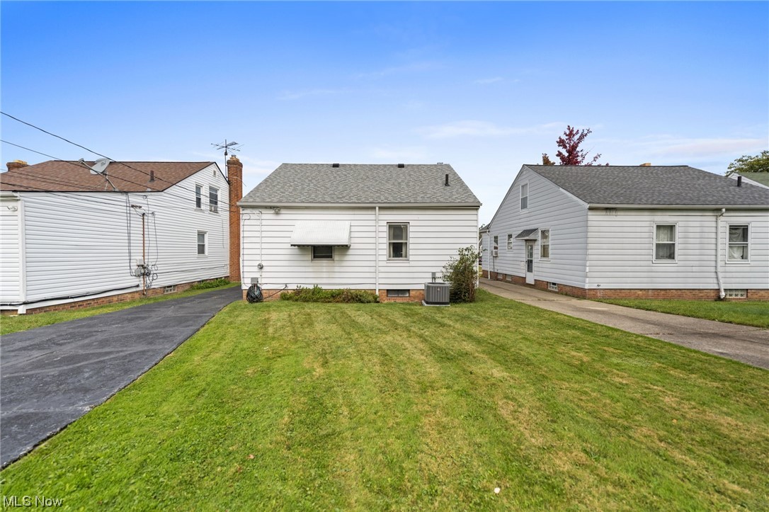 4170 Stilmore Road Cleveland, OH 44121 - Photo 23 of 26 View of front of home with a front lawn and central AC unit