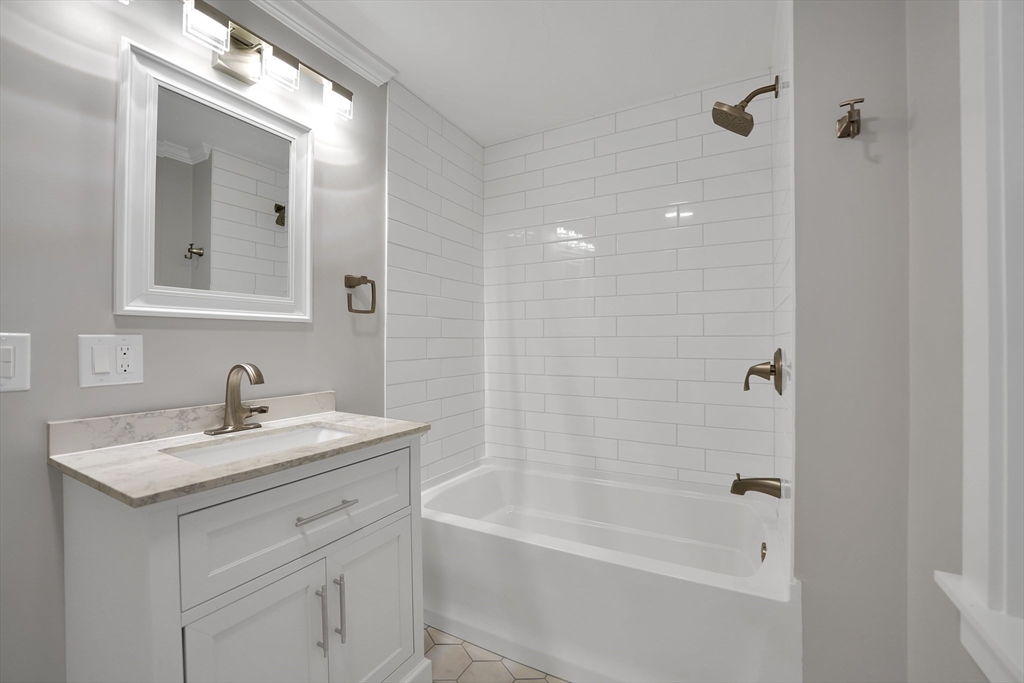 245 Wareham Road Marion, MA 02738 - Photo 16 of 42 a bathroom with a sink vanity tub and a mirror