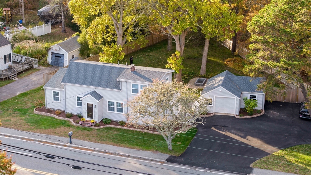 245 Wareham Road Marion, MA 02738 - Photo 3 of 42 a front view of a house with garden