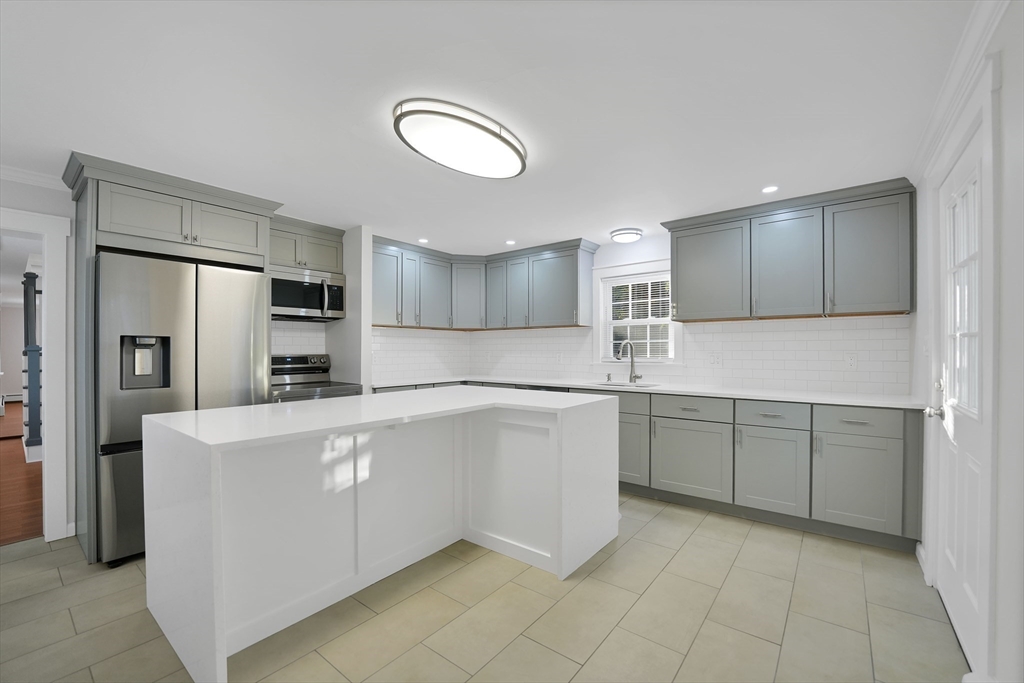 245 Wareham Road Marion, MA 02738 - Photo 6 of 42 a kitchen with stainless steel appliances granite countertop a refrigerator sink and cabinets