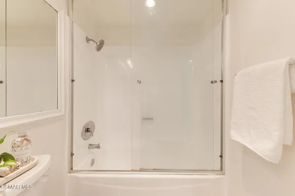 a bathroom with a bathtub and shower