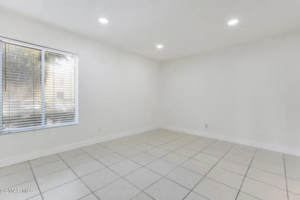 a bathroom with a toilet a sink and a mirror