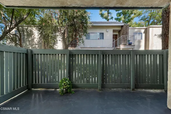 a view of parking garage with cars parked