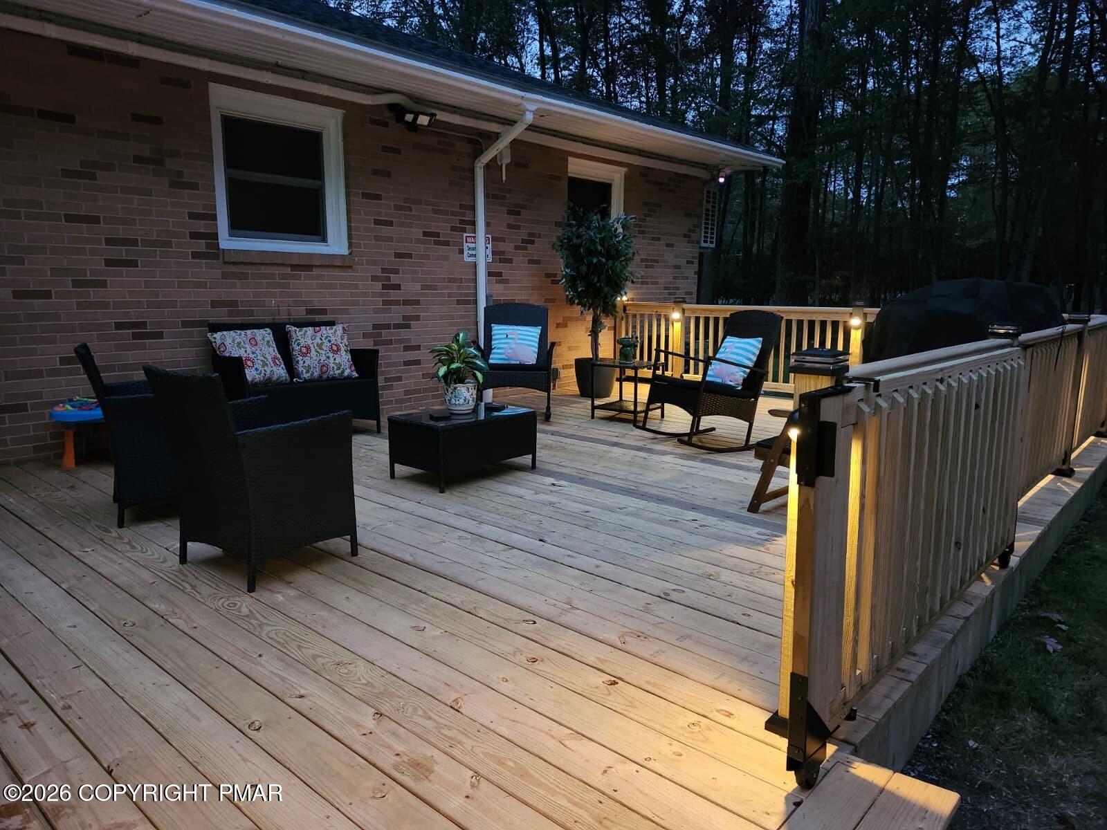 144 Highridge Road Albrightsville, PA 18210 - Photo 81 of 96 a view of a deck with wooden floor and outdoor seating