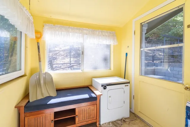 a bathroom with a sink a bathtub and next to a window
