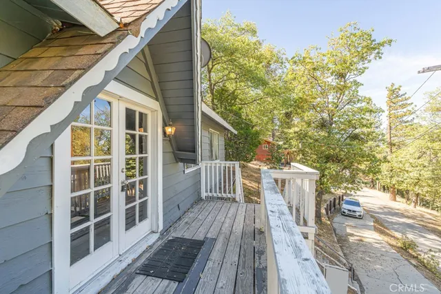 a view of a wooden deck and a yard