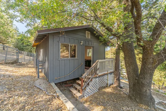 a room with furniture pool table and a window