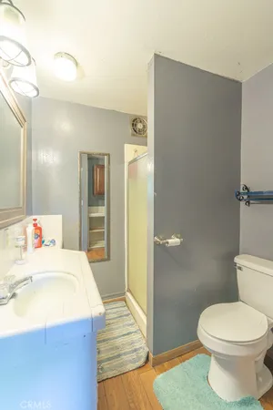 a kitchen with a stove a refrigerator and a sink