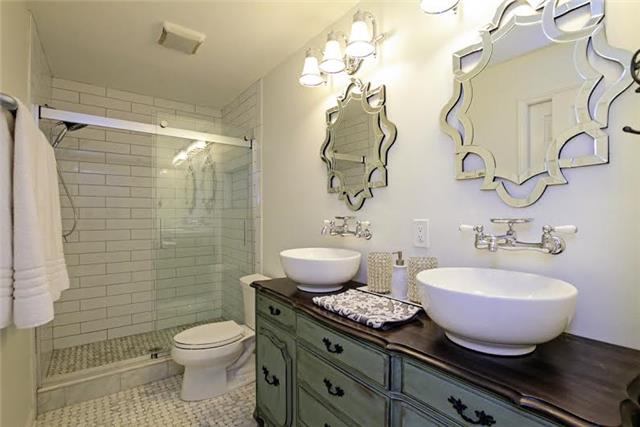 104 Ridgewood Road Franklin, TN 37064 - Photo 11 of 20 Gorgeous master bathroom was completely renovated. New sinks, new mirrors, new flooring, new tile...you name it, it's new! So much character!