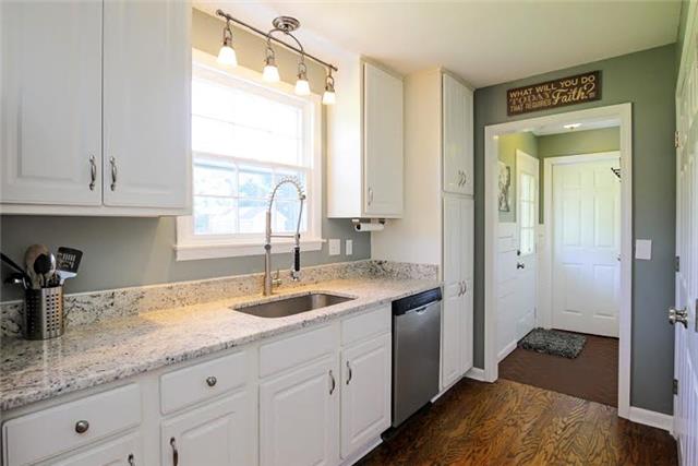 104 Ridgewood Road Franklin, TN 37064 - Photo 6 of 20 Check out the updated lighting, faucet, and the undermount sink. Look out the window at your enormous yard while washing the dishes. So much counter space and so many cabinets in this wonderful kitchen.