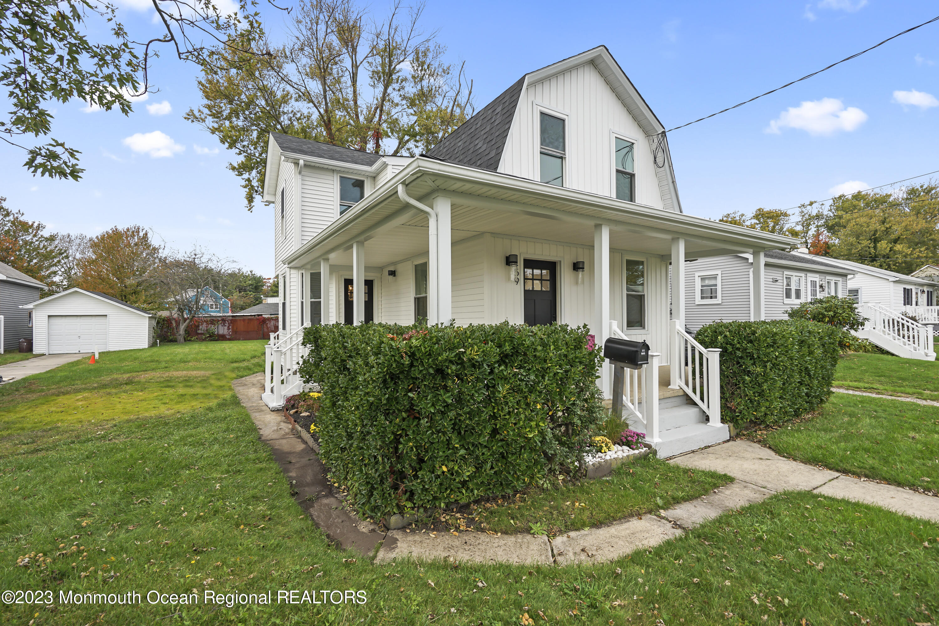 59 Ridge Avenue Neptune City, NJ 07753 - Photo 3 of 20 a front view of a house with a yard