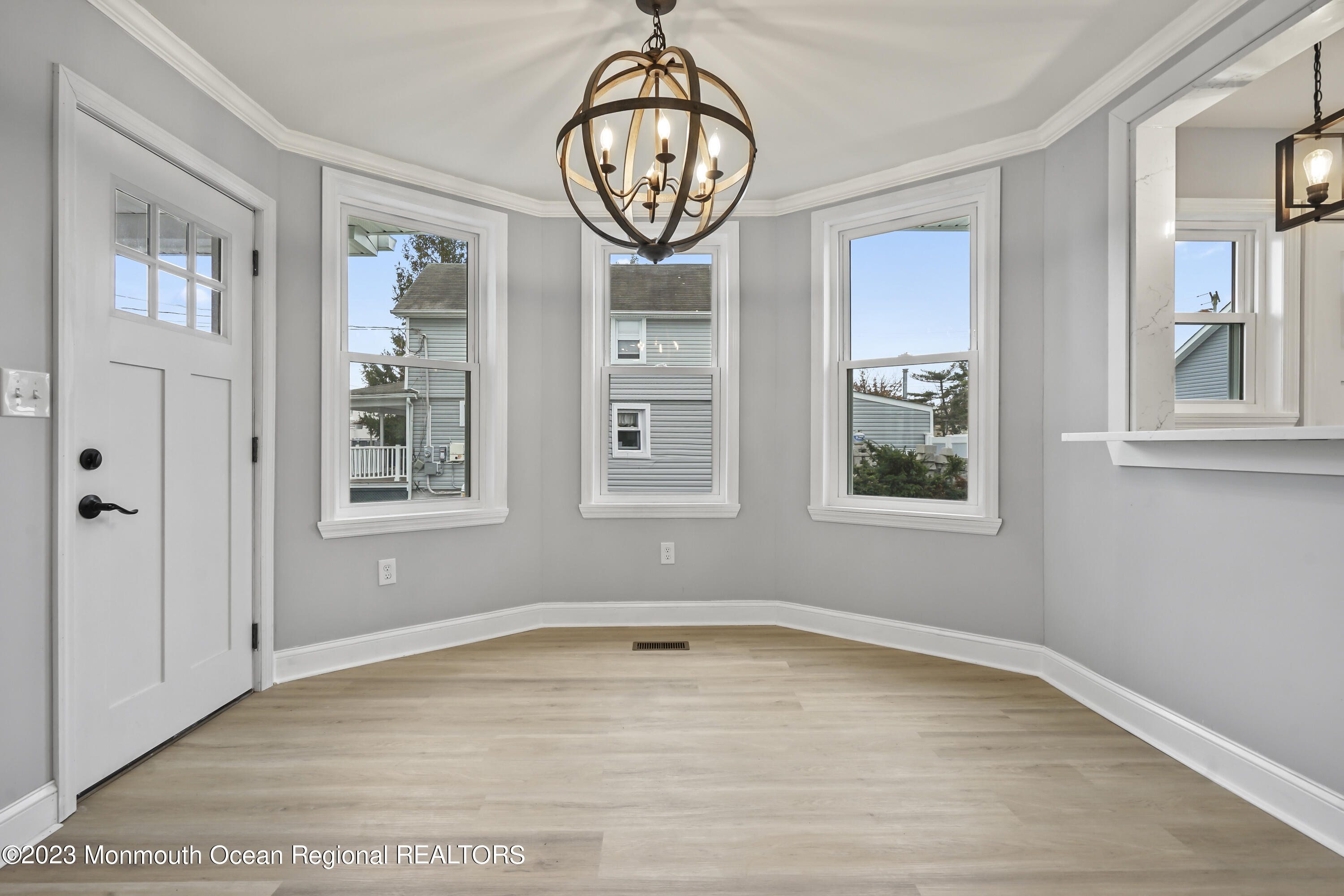 59 Ridge Avenue Neptune City, NJ 07753 - Photo 8 of 20 a view of an entryway with wooden floor and door