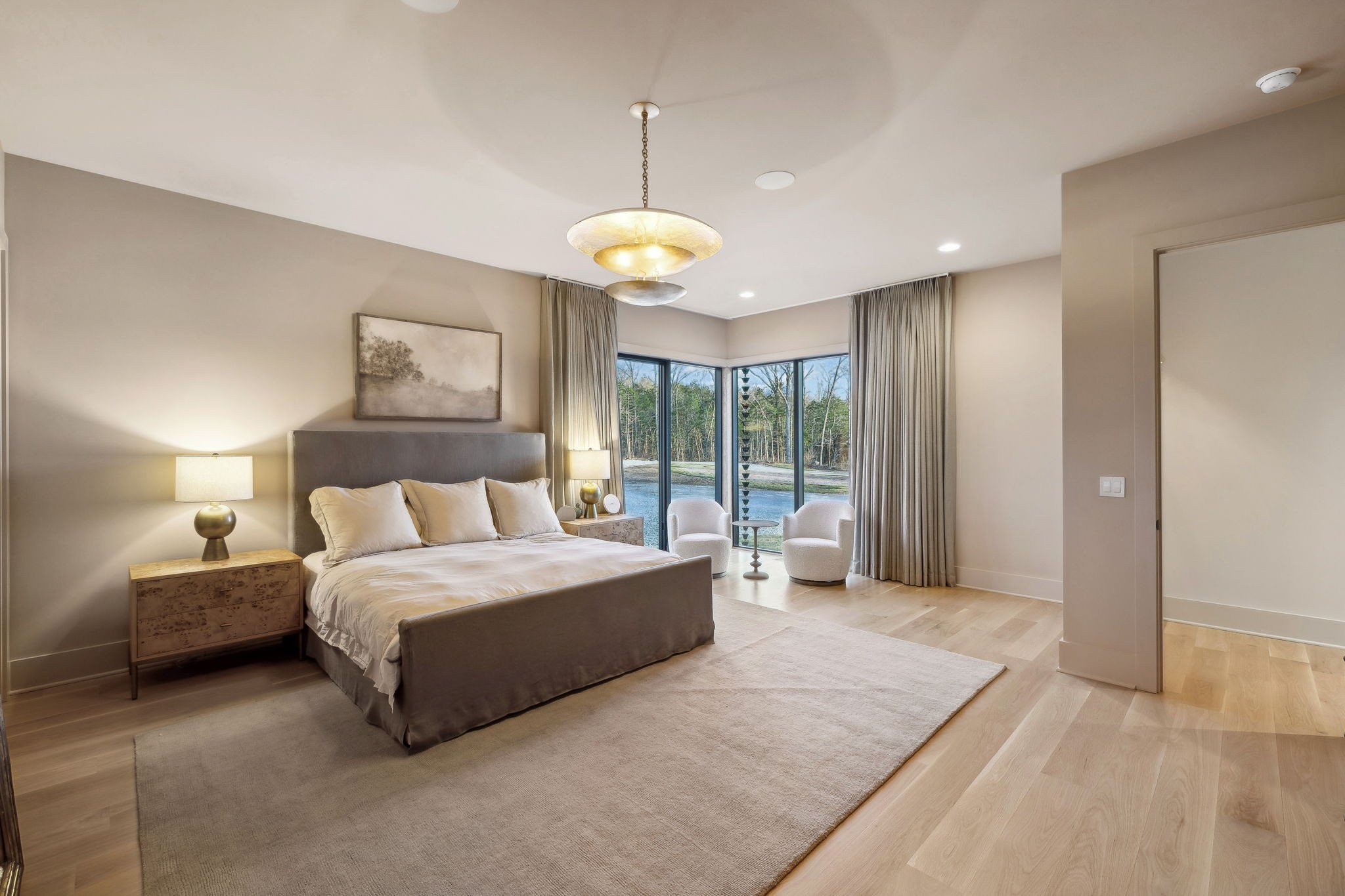 4640 Murfreesboro Road Franklin, TN 37067 - Photo 57 of 79 a spacious bedroom with a large bed and a chandelier