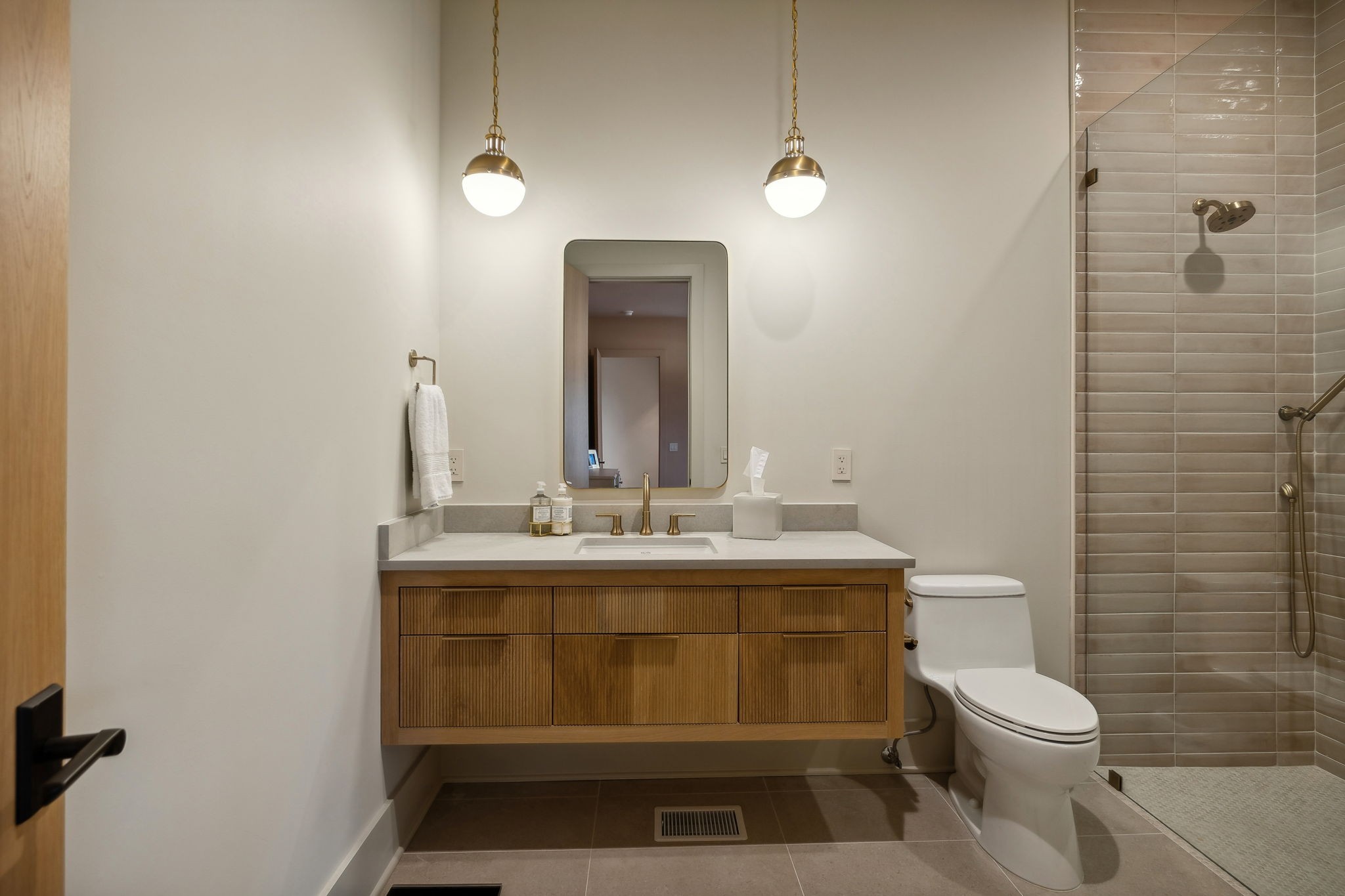 4640 Murfreesboro Road Franklin, TN 37067 - Photo 58 of 79 a bathroom with a toilet a sink and mirror