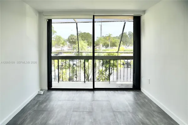 a view of an entryway with wooden floor