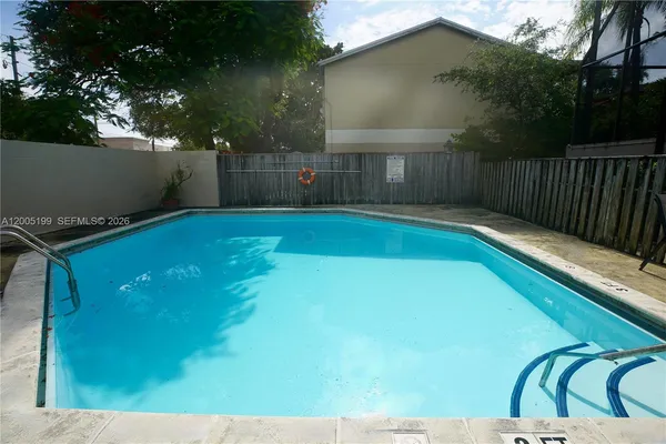 a view of swimming pool with a yard